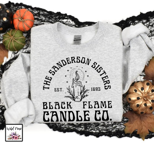 Grey sweatshirt folded with the text Black Frame Candle Company on the front